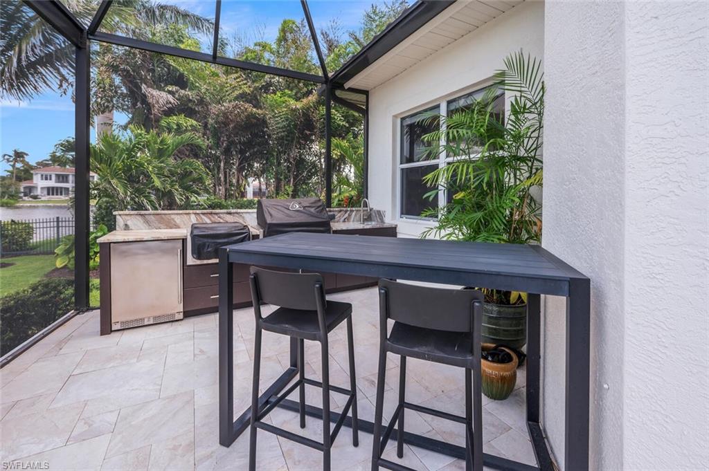 4129 Willowhead Way Naples, FL 34103 - Photo 48 of 50 a view of an outdoor seating area