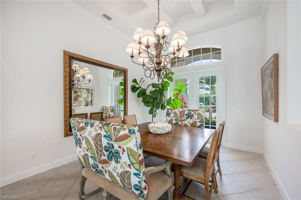 4129 Willowhead Way Naples, FL 34103 - Photo 6 of 50 a view of a dining room with furniture and chandelier