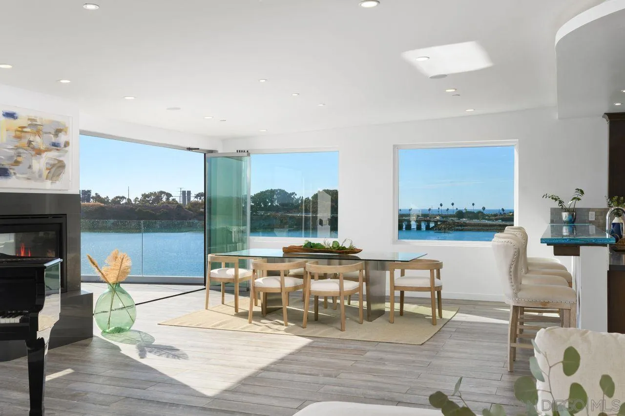4465 Adams Street Carlsbad, CA 92008 - Photo 22 of 59 a living room with a couch and a floor to ceiling window