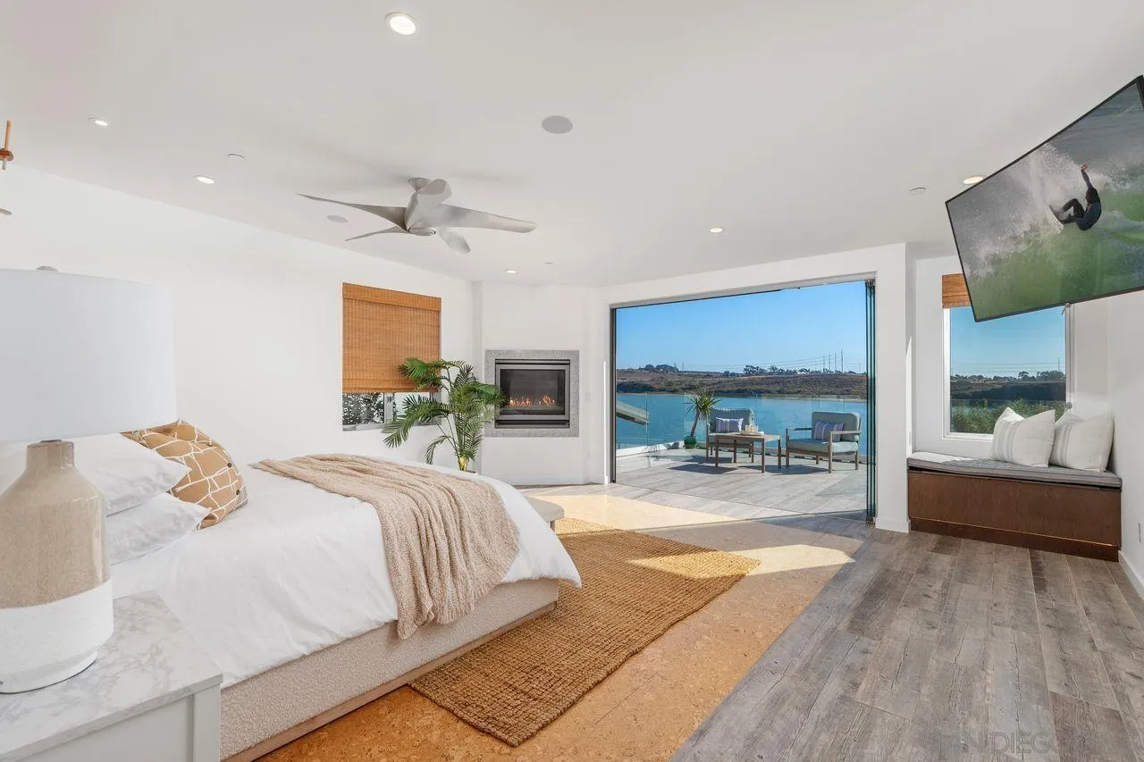4465 Adams Street Carlsbad, CA 92008 - Photo 28 of 59 a bedroom with a bed and a large window with outer view