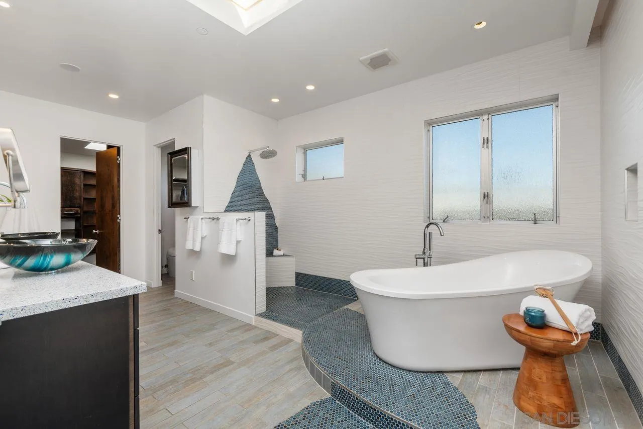4465 Adams Street Carlsbad, CA 92008 - Photo 30 of 59 a bathroom with a sink and a mirror