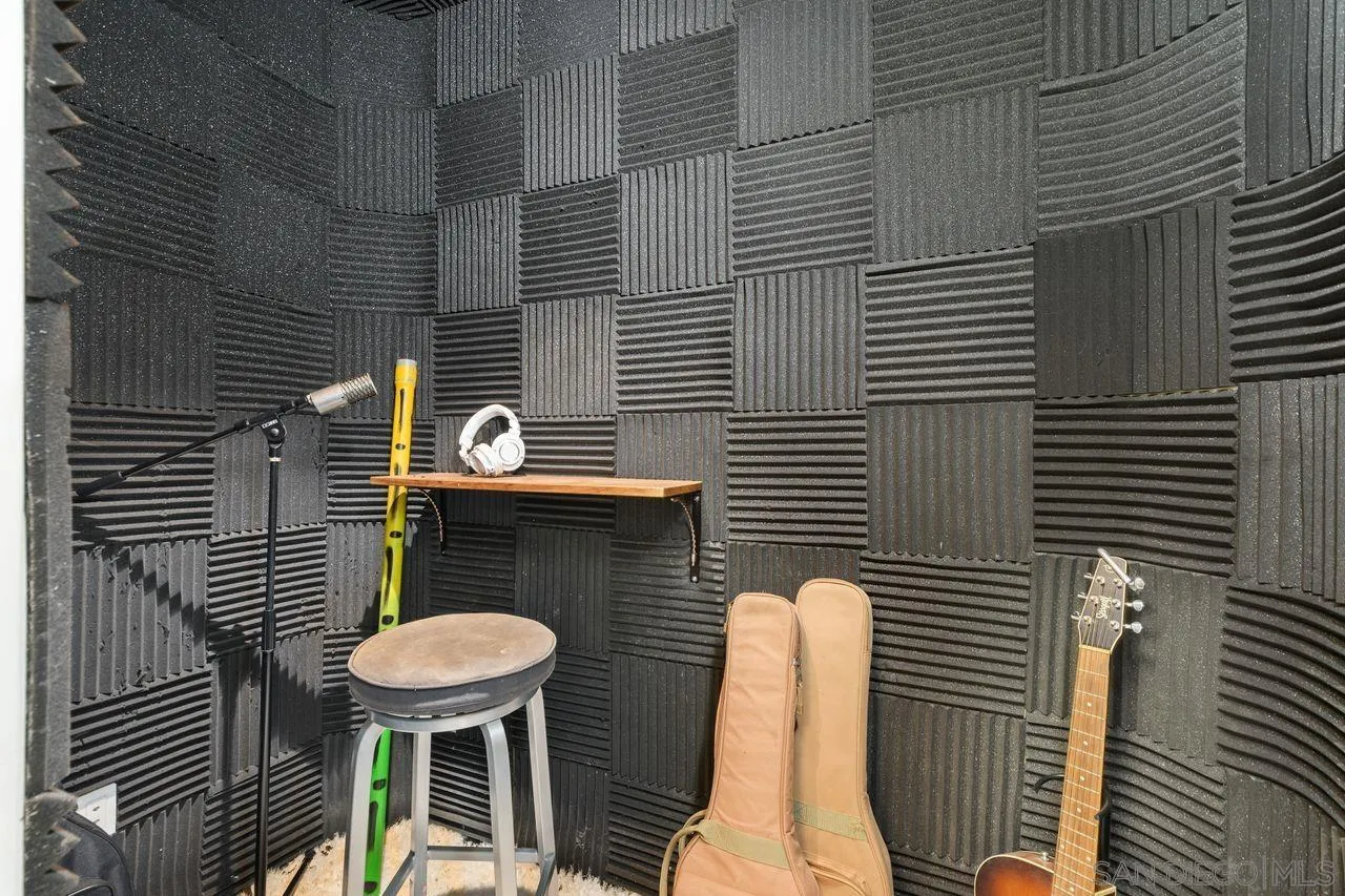 4465 Adams Street Carlsbad, CA 92008 - Photo 40 of 59 a front view of a house with table and chairs
