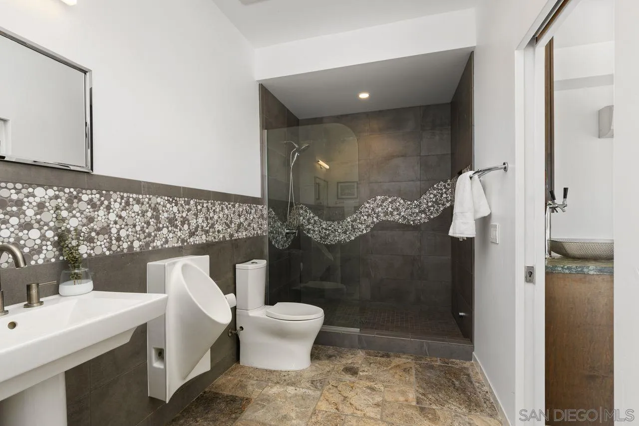 4465 Adams Street Carlsbad, CA 92008 - Photo 46 of 59 a bathroom with a toilet and a shower