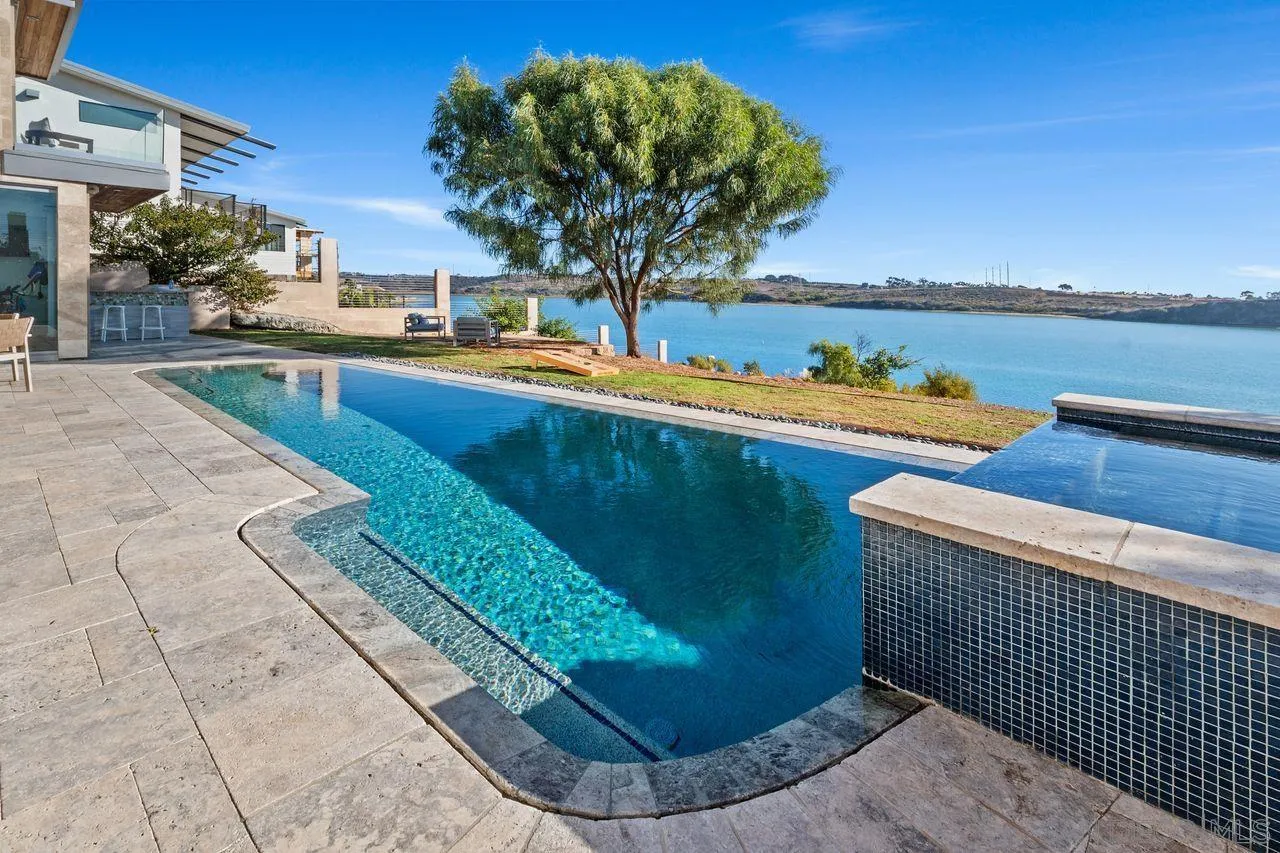 4465 Adams Street Carlsbad, CA 92008 - Photo 47 of 59 a view of a swimming pool with a lounge chairs