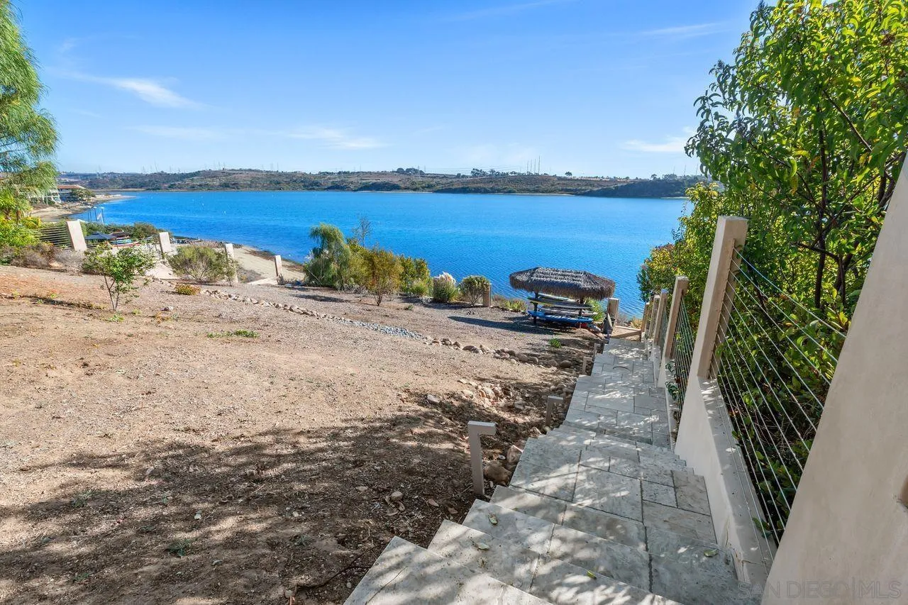 4465 Adams Street Carlsbad, CA 92008 - Photo 52 of 59 a view of a lake with beach and large trees