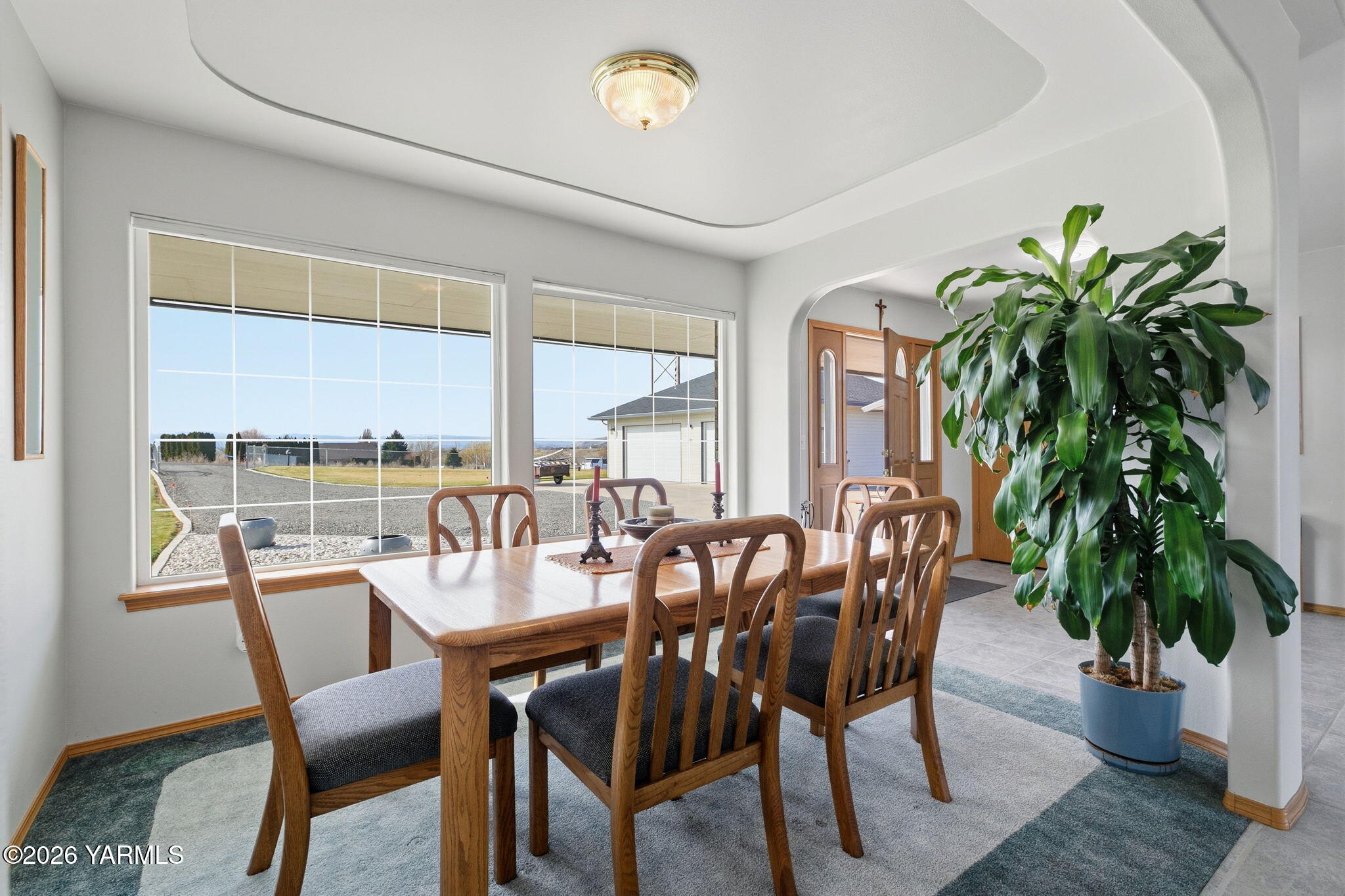 461 White Road Yakima, WA 98901 - Photo 17 of 36 a dining room with furniture potted plants and wooden floor