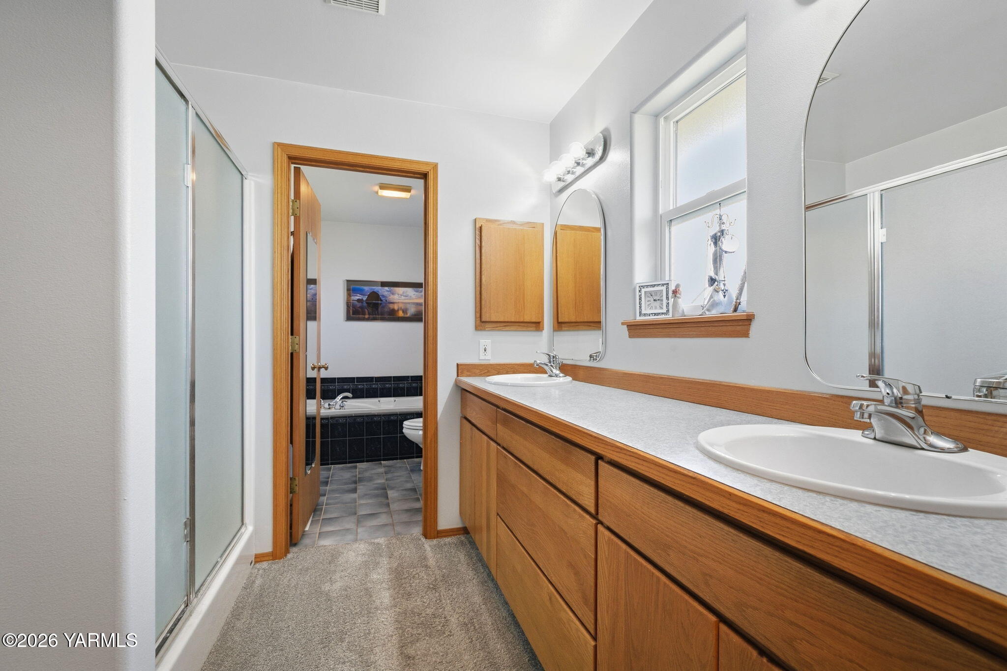 461 White Road Yakima, WA 98901 - Photo 25 of 36 a en suite bathroom with a sink and a mirror