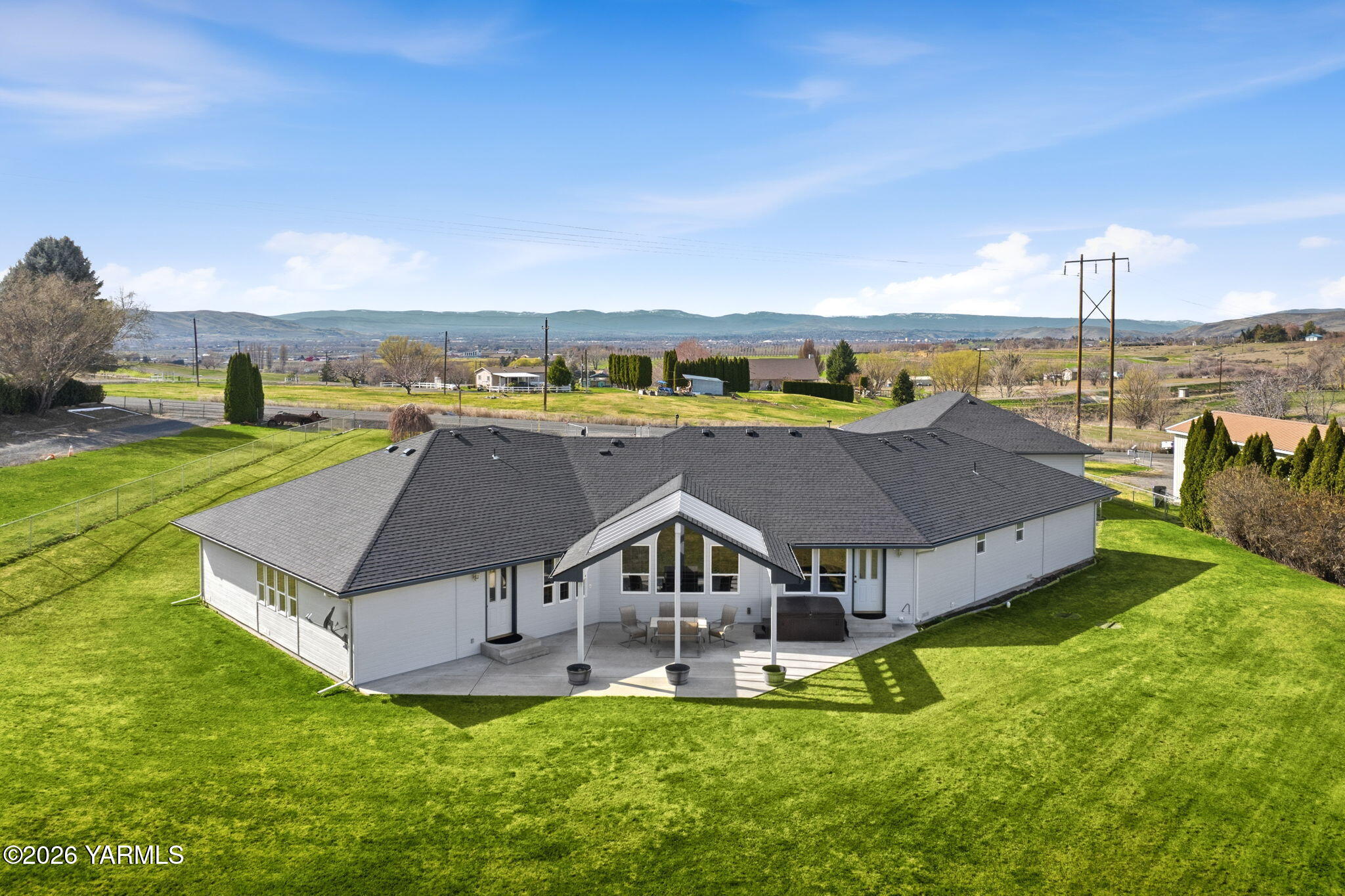 461 White Road Yakima, WA 98901 - Photo 6 of 36 a aerial view of a house with a big yard and large trees
