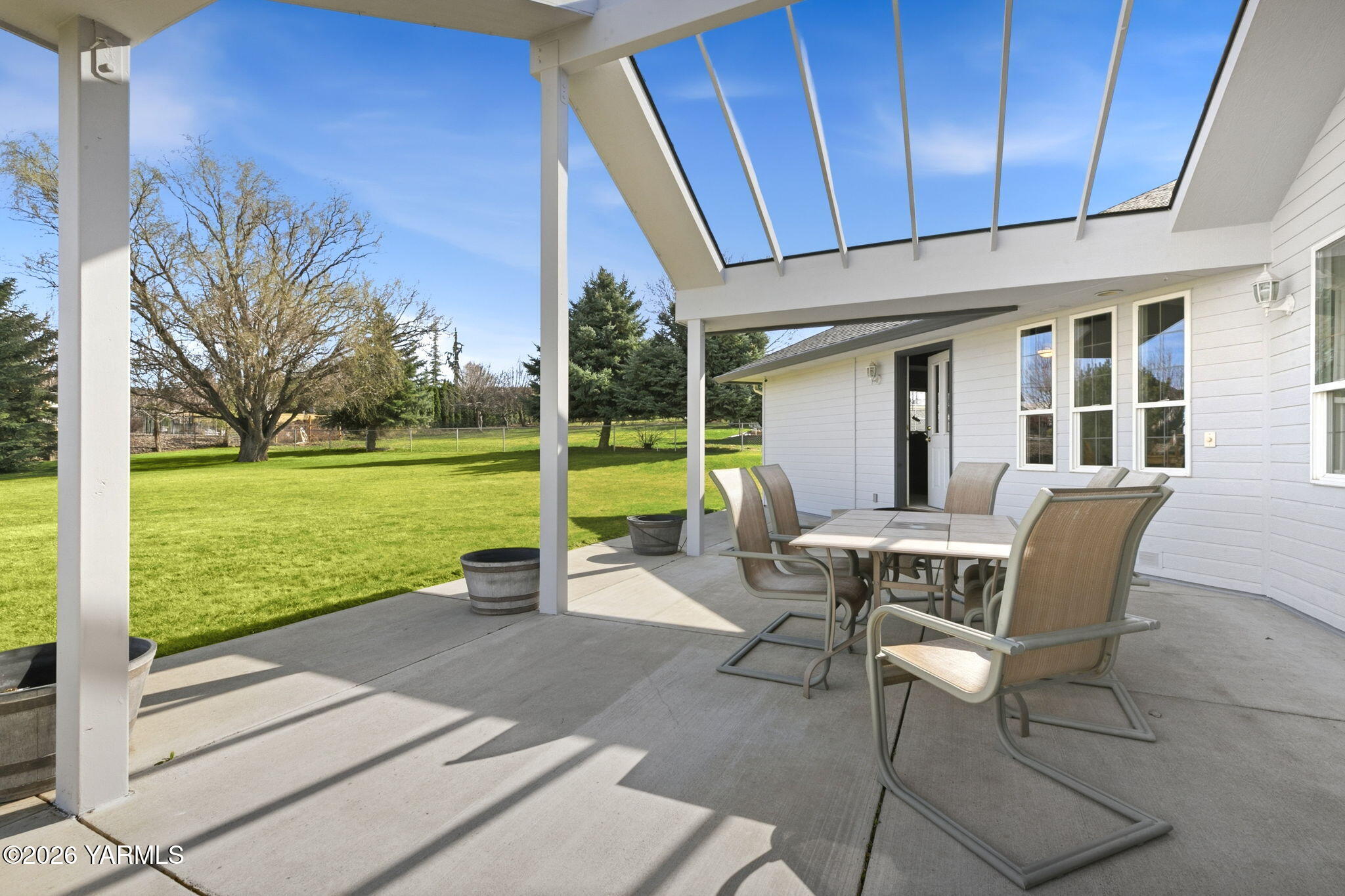 461 White Road Yakima, WA 98901 - Photo 10 of 36 a view of a patio with a table chairs and backyard