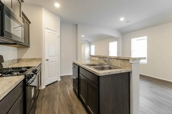 a kitchen with a stove and a sink