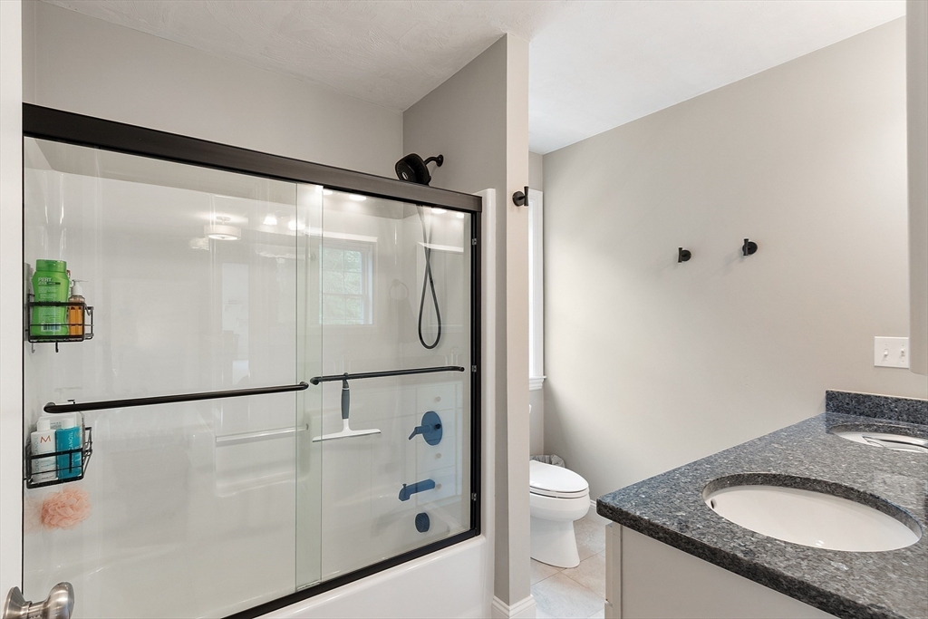 46 Jordan Road Holden, MA 01520 - Photo 28 of 42 a bathroom with a granite countertop sink toilet and shower