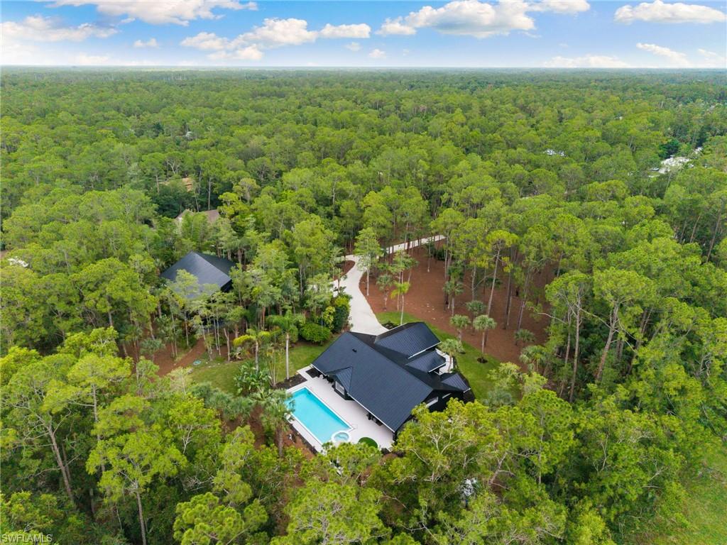 4521 3rd Avenue Northwest Naples, FL 34119 - Photo 45 of 46 an aerial view of a house with a yard