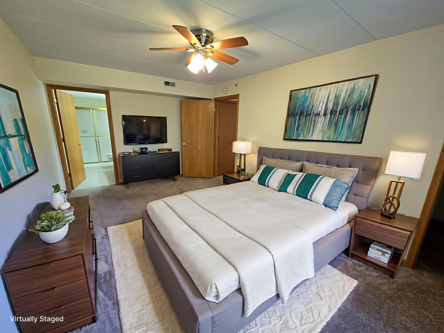 6860 Winding Trail, Unit 204 Oak Forest, IL 60452 - Photo 9 of 14 a bedroom with a bed a couch and a chandelier