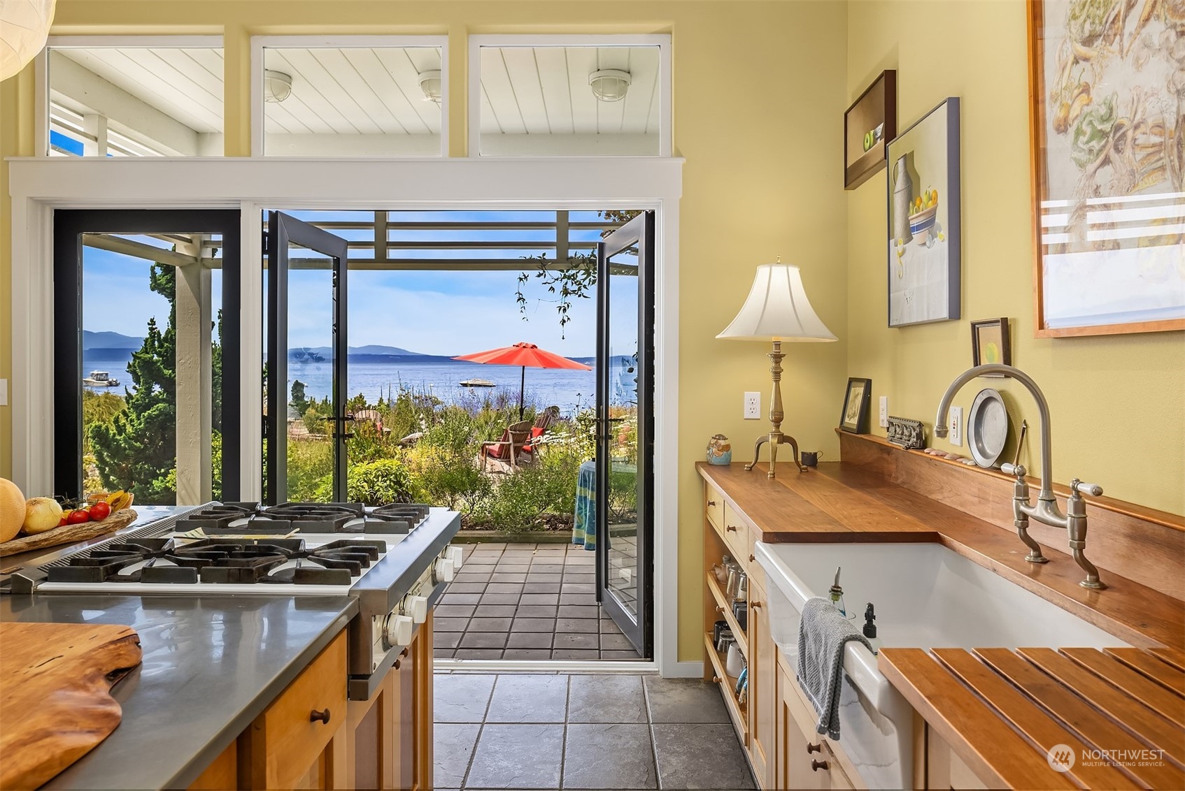 6346 South Bay Road Freeland, WA 98249 - Photo 13 of 40 a kitchen with a stove a sink and a refrigerator