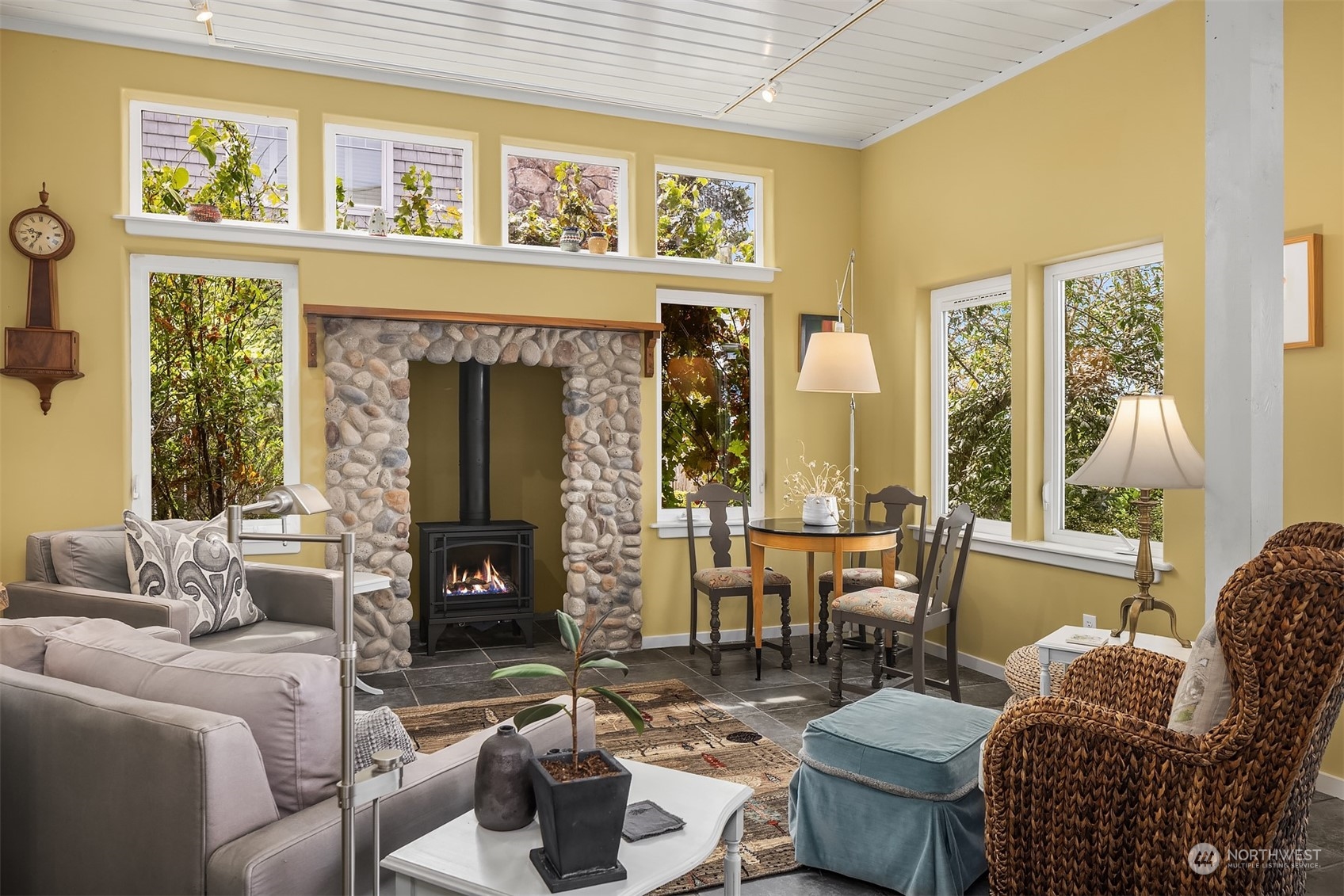 6346 South Bay Road Freeland, WA 98249 - Photo 15 of 40 a living room with furniture and a fireplace