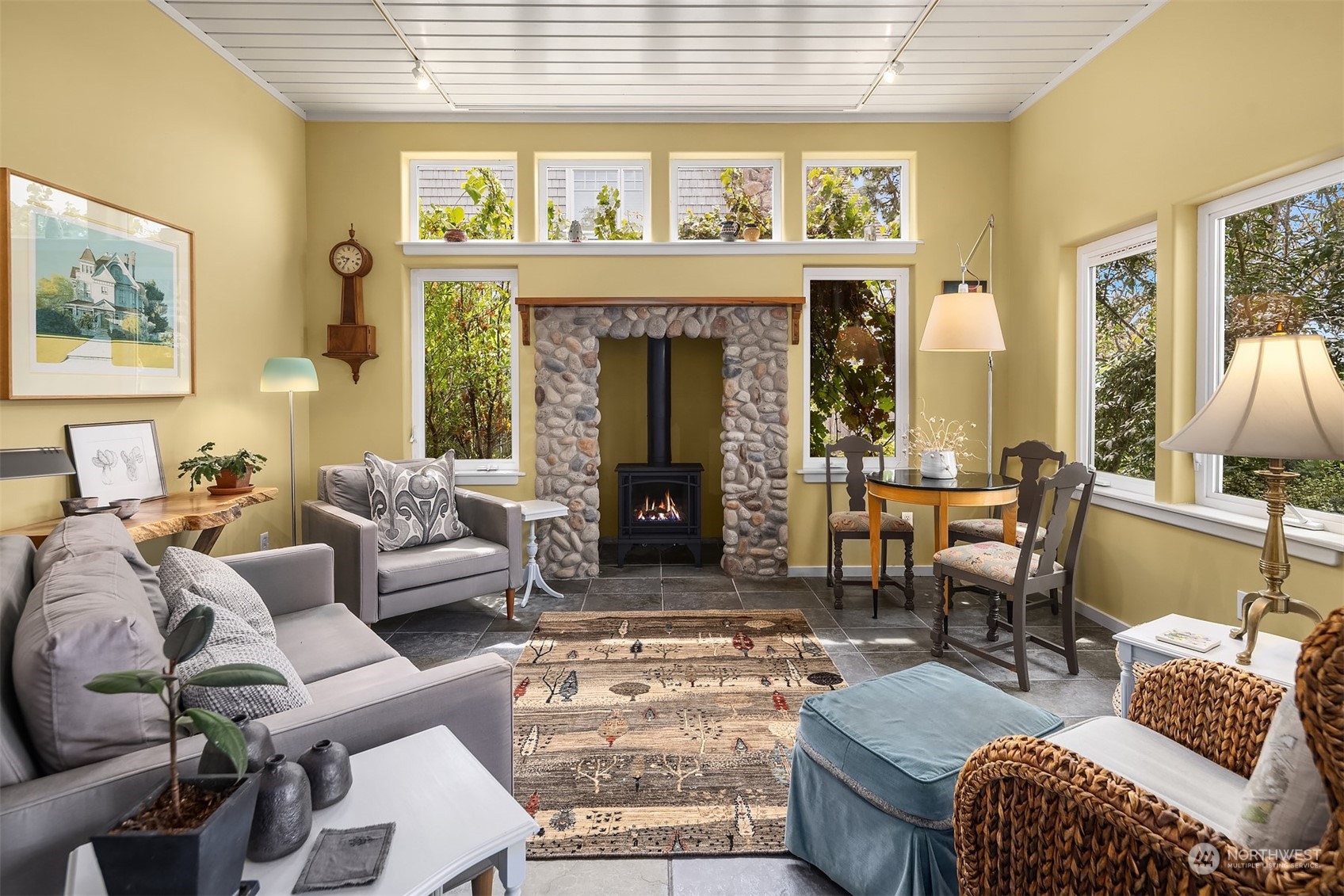6346 South Bay Road Freeland, WA 98249 - Photo 16 of 40 a living room with furniture and a fireplace