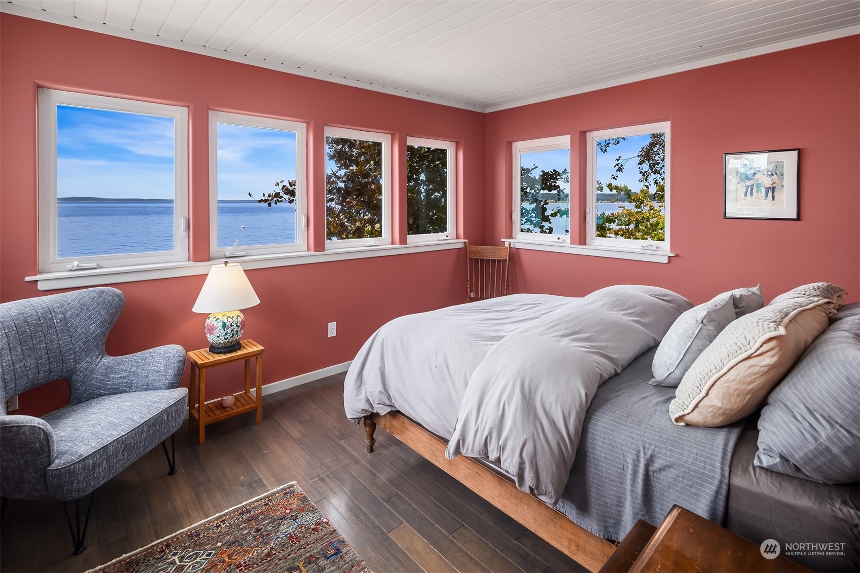 6346 South Bay Road Freeland, WA 98249 - Photo 24 of 40 a bedroom with a bed and wooden floor