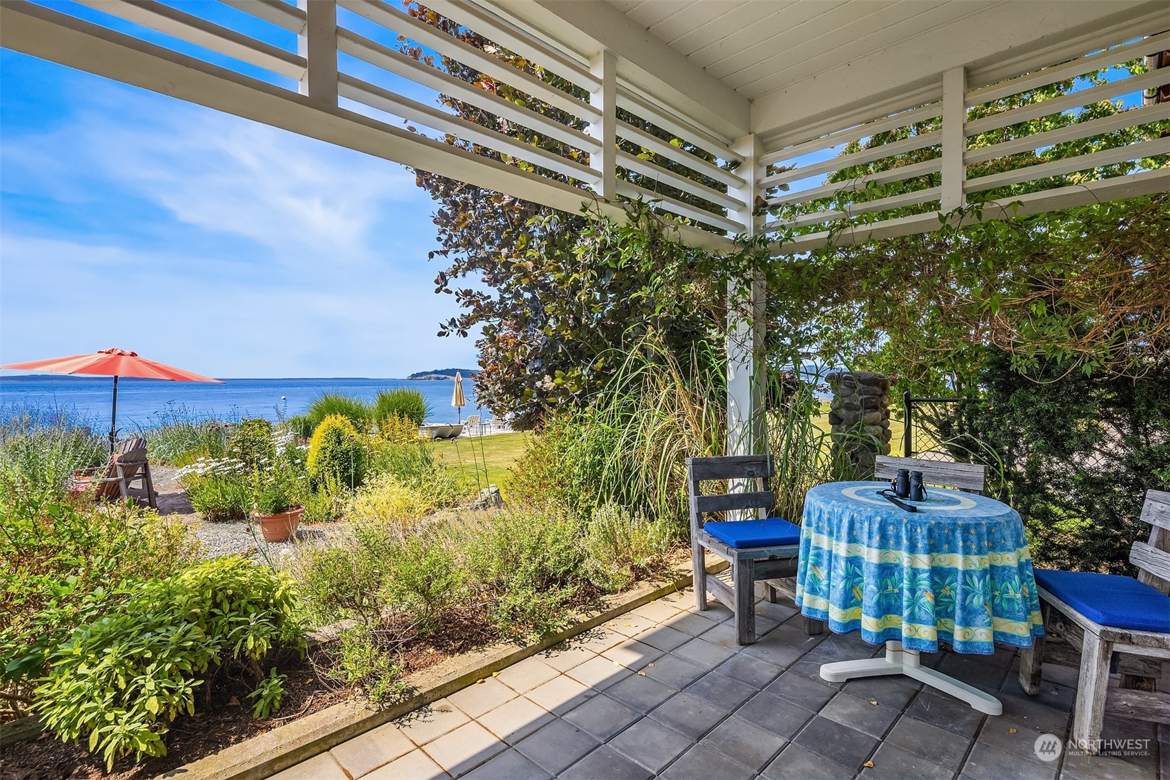 6346 South Bay Road Freeland, WA 98249 - Photo 31 of 40 a backyard of a house with a garden and outdoor seating