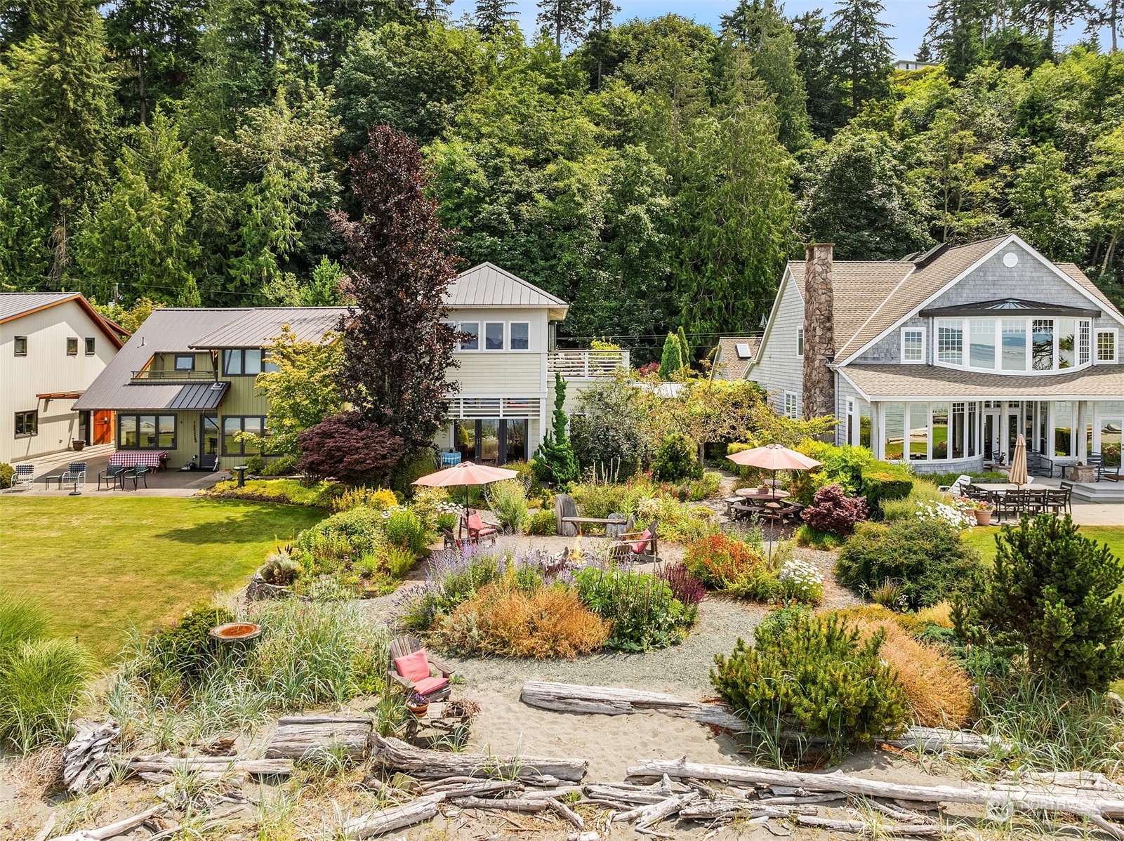 6346 South Bay Road Freeland, WA 98249 - Photo 8 of 40 a front view of a house with a yard patio and lake view