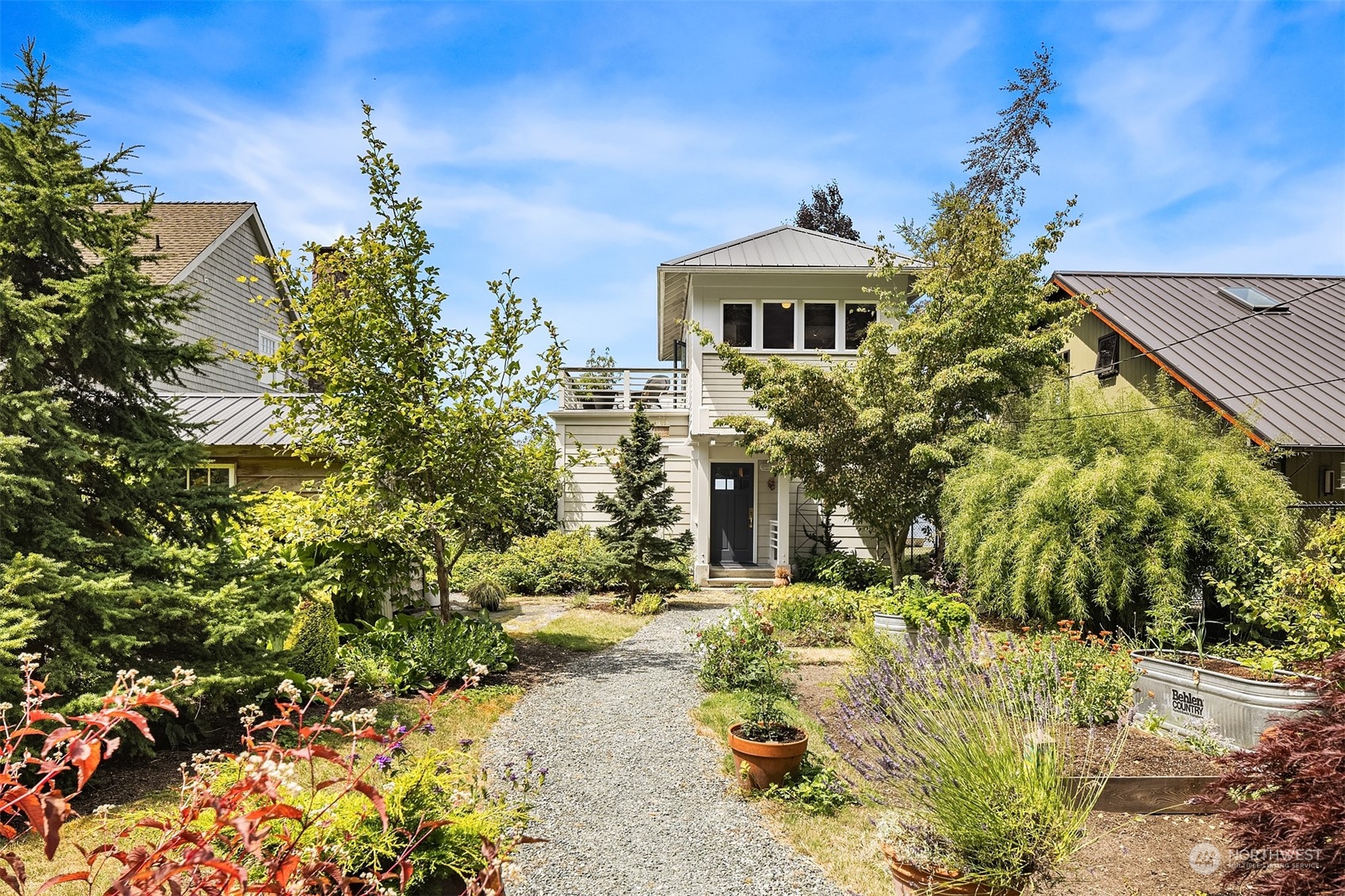 6346 South Bay Road Freeland, WA 98249 - Photo 10 of 40 a front view of a house with a yard