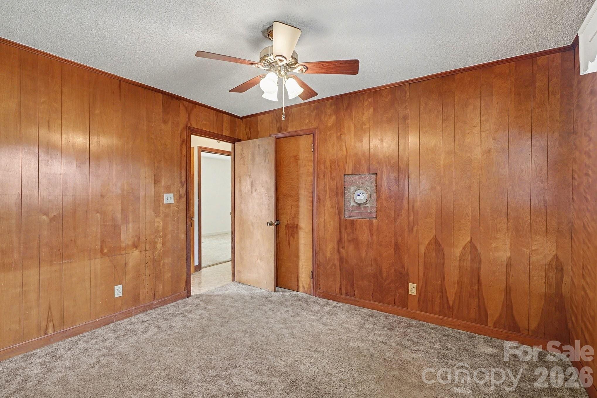 1612 Shelby Road, Unit 1417 Kings Mountain, NC 28086 - Photo 11 of 29 a view of a hallway with a chandelier fan