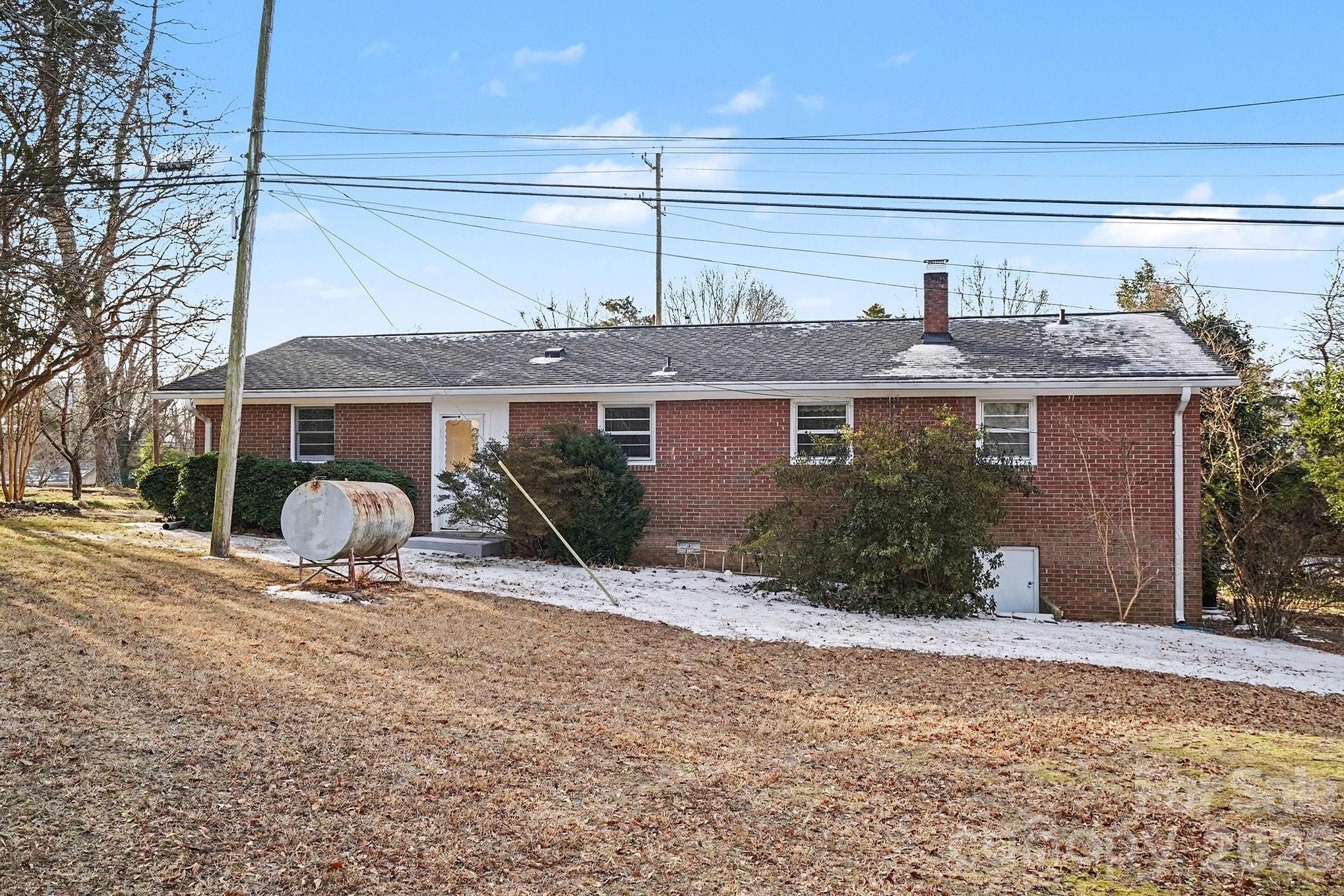 1612 Shelby Road, Unit 1417 Kings Mountain, NC 28086 - Photo 20 of 29 a front view of a house with garden