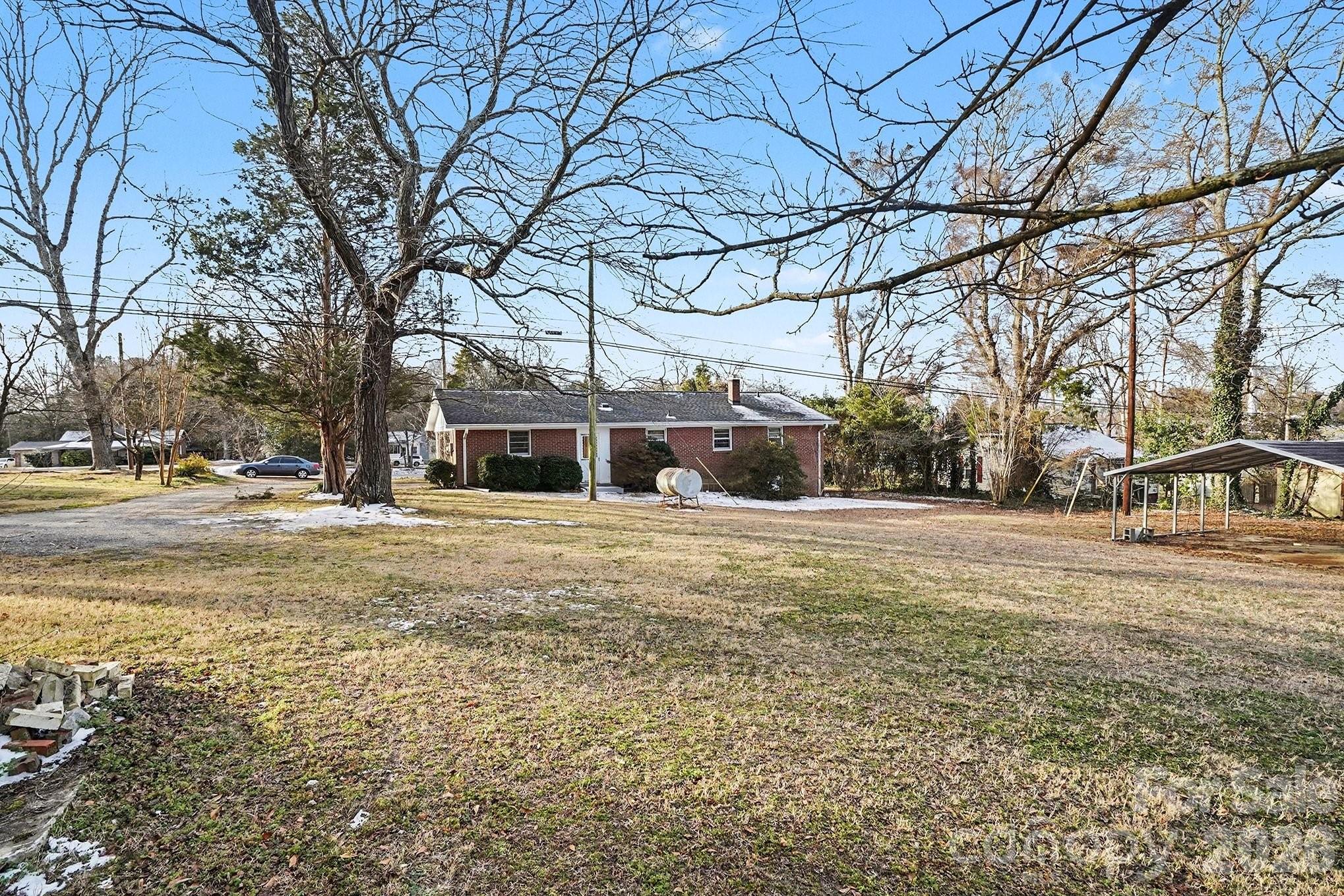 1612 Shelby Road, Unit 1417 Kings Mountain, NC 28086 - Photo 22 of 29 a front view of a building with large trees