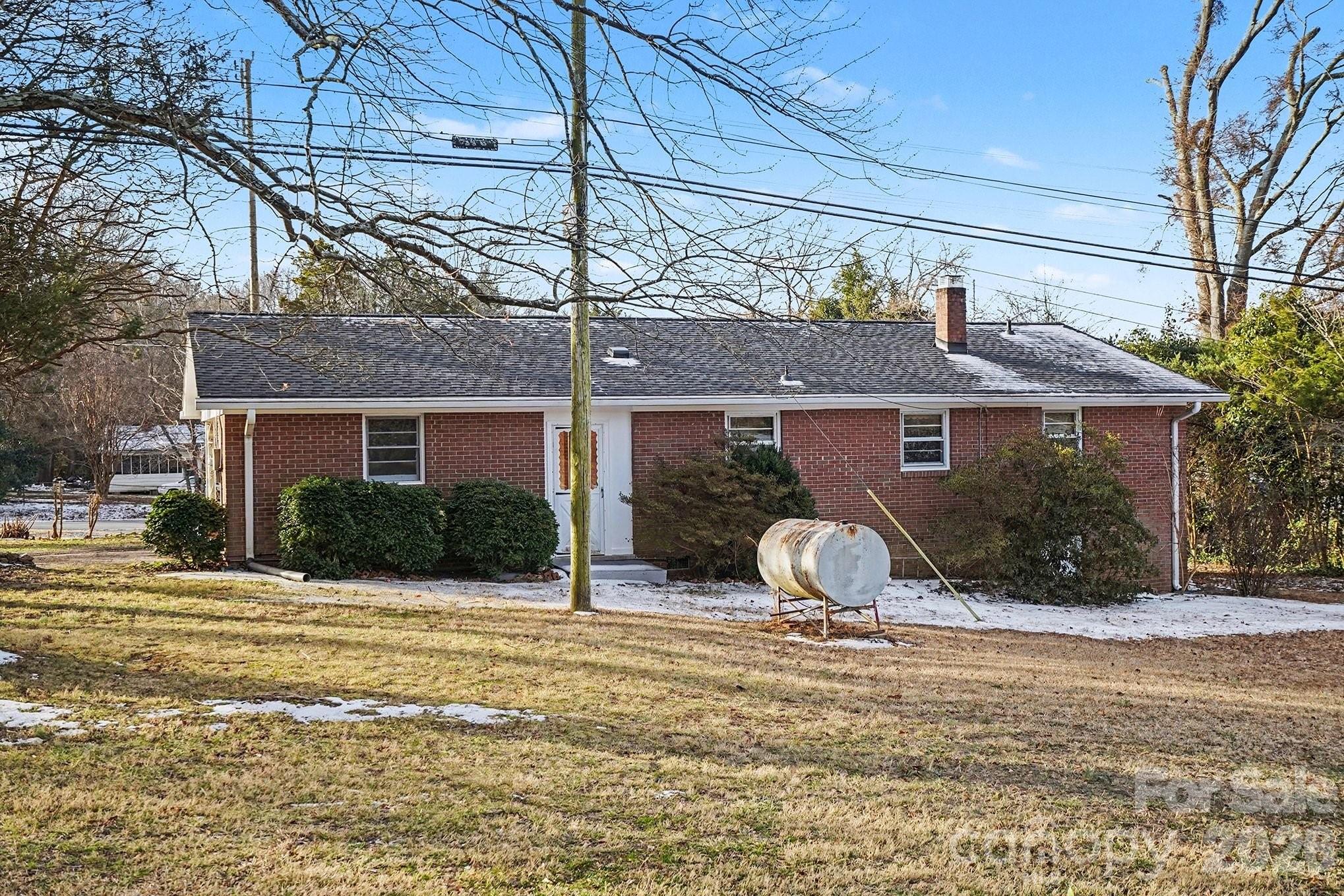 1612 Shelby Road, Unit 1417 Kings Mountain, NC 28086 - Photo 25 of 29 a front view of a house with a yard