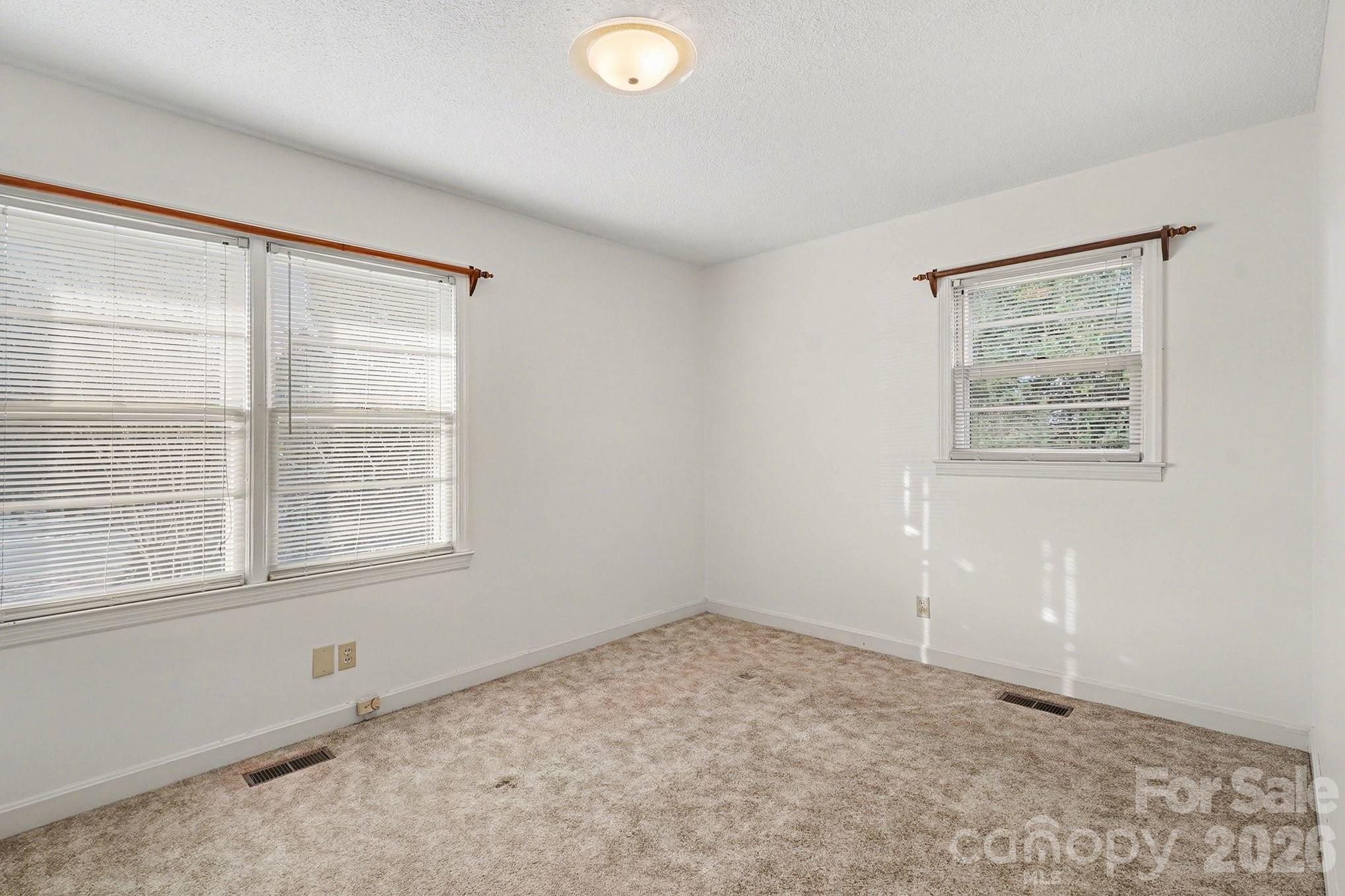 1612 Shelby Road, Unit 1417 Kings Mountain, NC 28086 - Photo 28 of 29 an empty room with a window