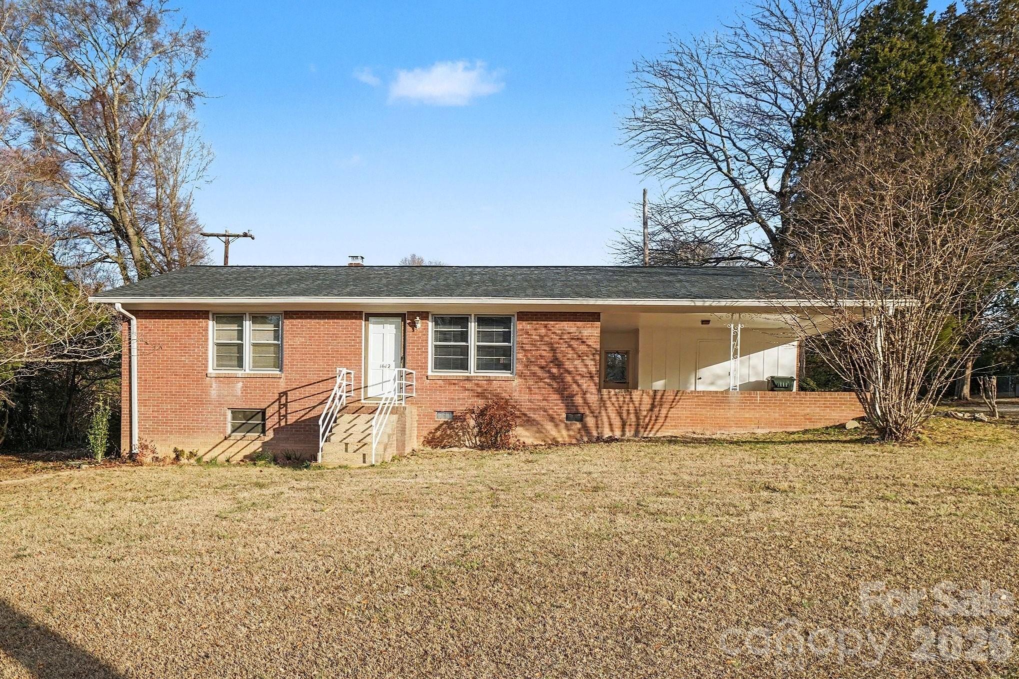 1612 Shelby Road, Unit 1417 Kings Mountain, NC 28086 - Photo 8 of 29 a front view of a house with a yard