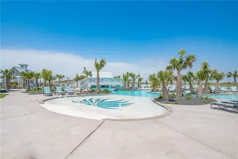 a view of a swimming pool with outdoor seating