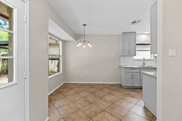 a view of a kitchen and a window