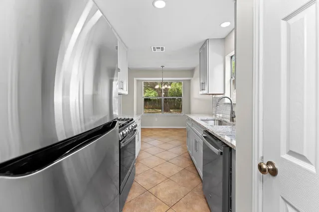 a large kitchen with a large window