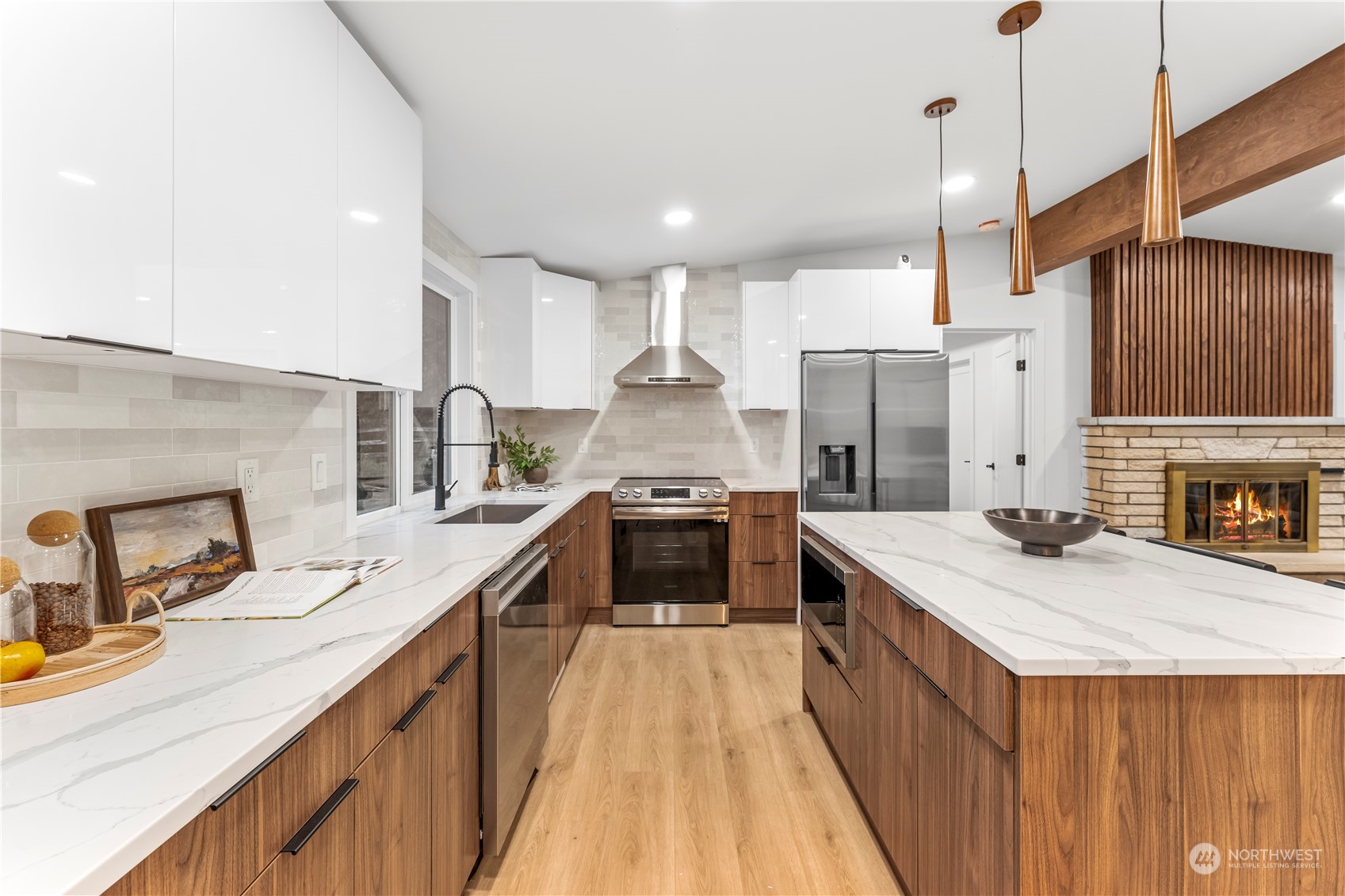 23033 192nd Avenue Southeast Renton, WA 98058 - Photo 11 of 40 a kitchen with stainless steel appliances kitchen island granite countertop a sink stove and refrigerator