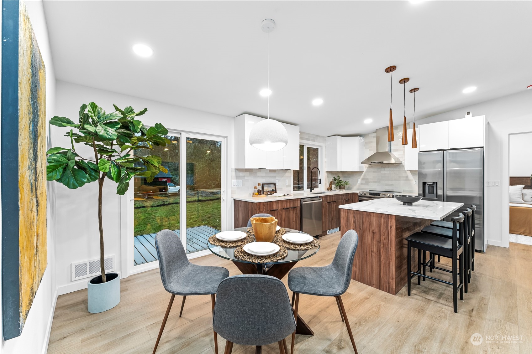 23033 192nd Avenue Southeast Renton, WA 98058 - Photo 14 of 40 a view of a dining room with furniture window and wooden floor