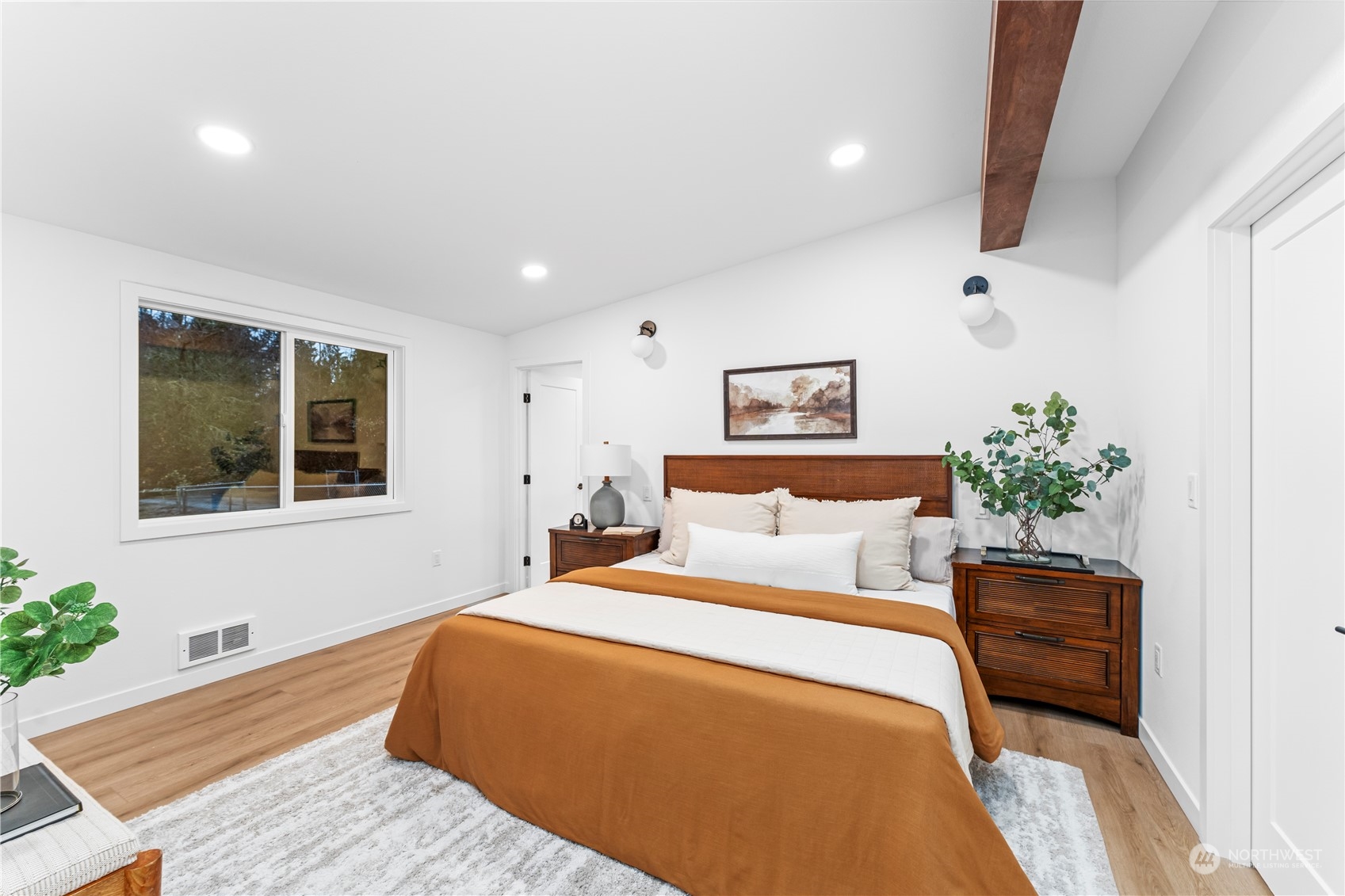 23033 192nd Avenue Southeast Renton, WA 98058 - Photo 17 of 40 a bedroom with a large bed and a potted plant