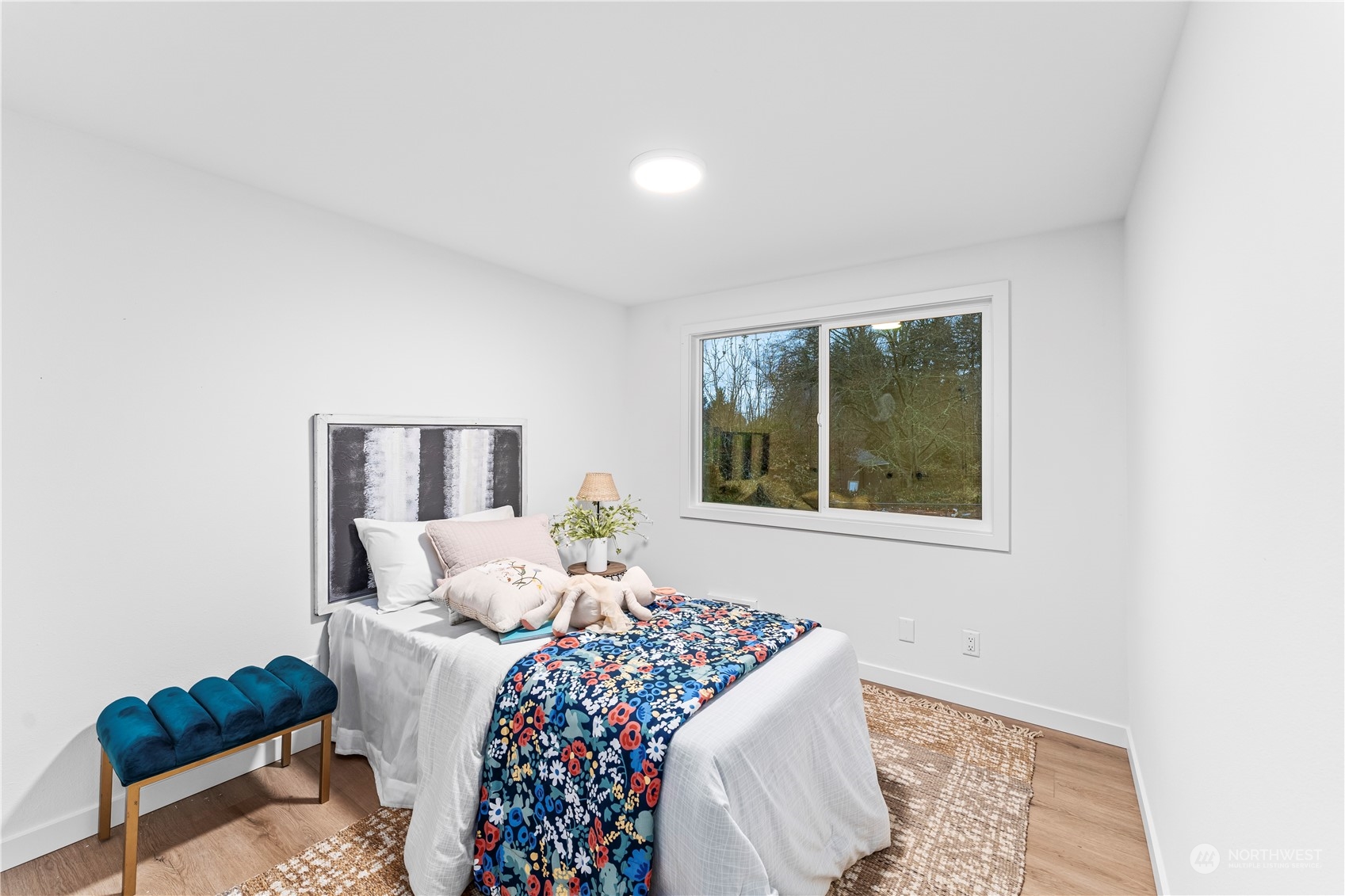 23033 192nd Avenue Southeast Renton, WA 98058 - Photo 24 of 40 a bedroom with a bed and a window