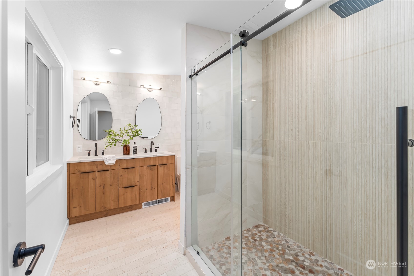 23033 192nd Avenue Southeast Renton, WA 98058 - Photo 27 of 40 a bathroom with a double vanity sink mirror and shower