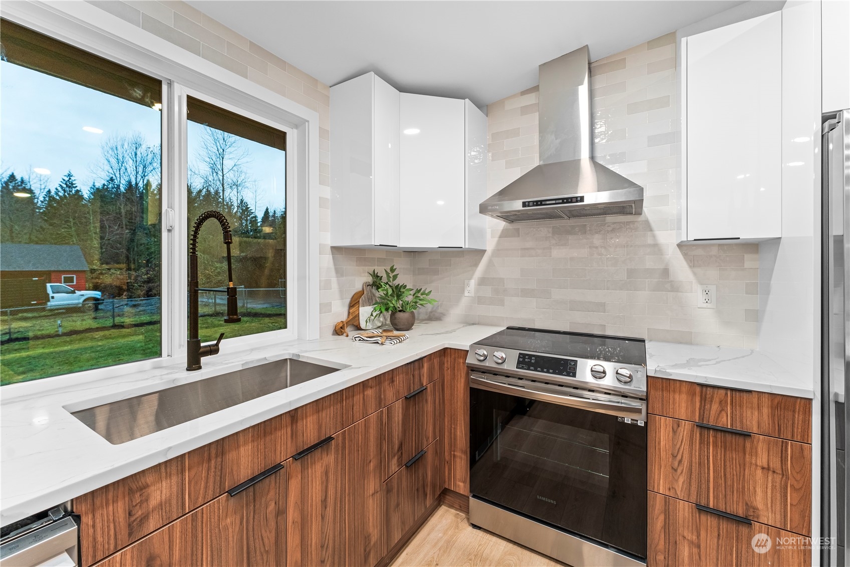 23033 192nd Avenue Southeast Renton, WA 98058 - Photo 30 of 40 a kitchen with a stove and a sink