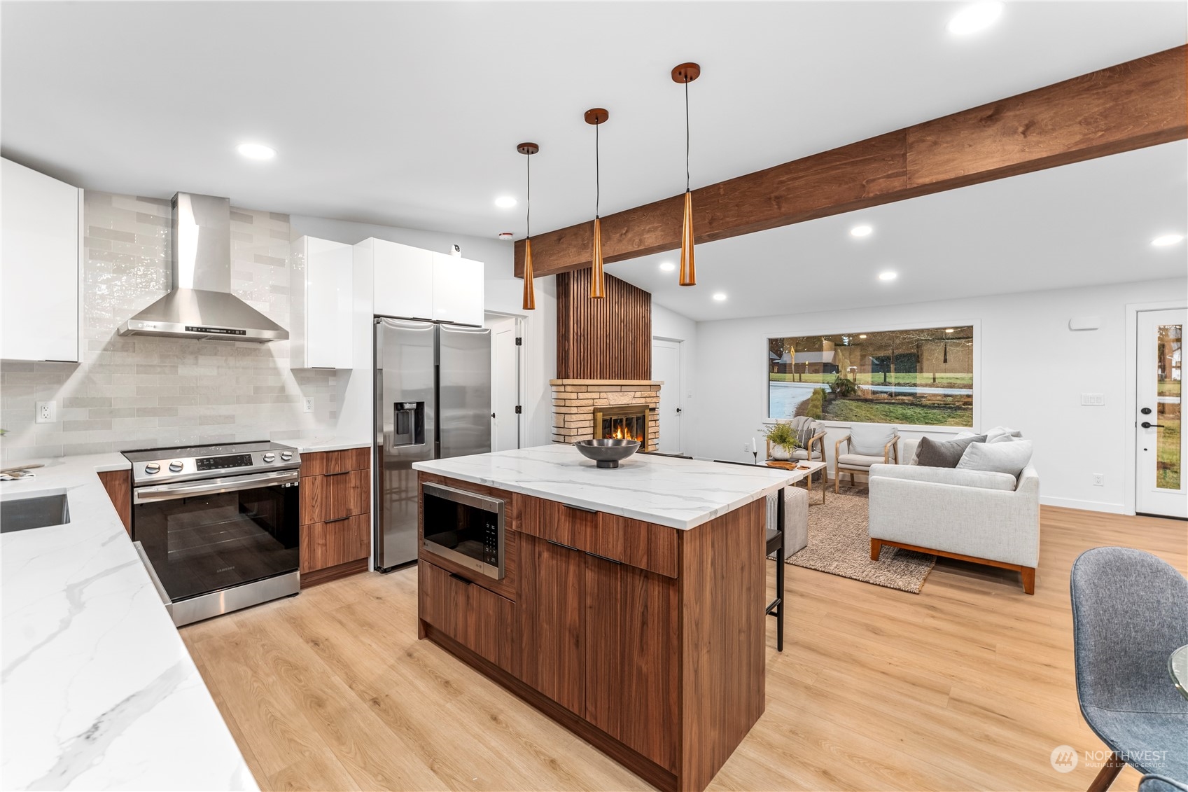 23033 192nd Avenue Southeast Renton, WA 98058 - Photo 33 of 40 a large kitchen with stainless steel appliances a stove a sink dishwasher and a refrigerator