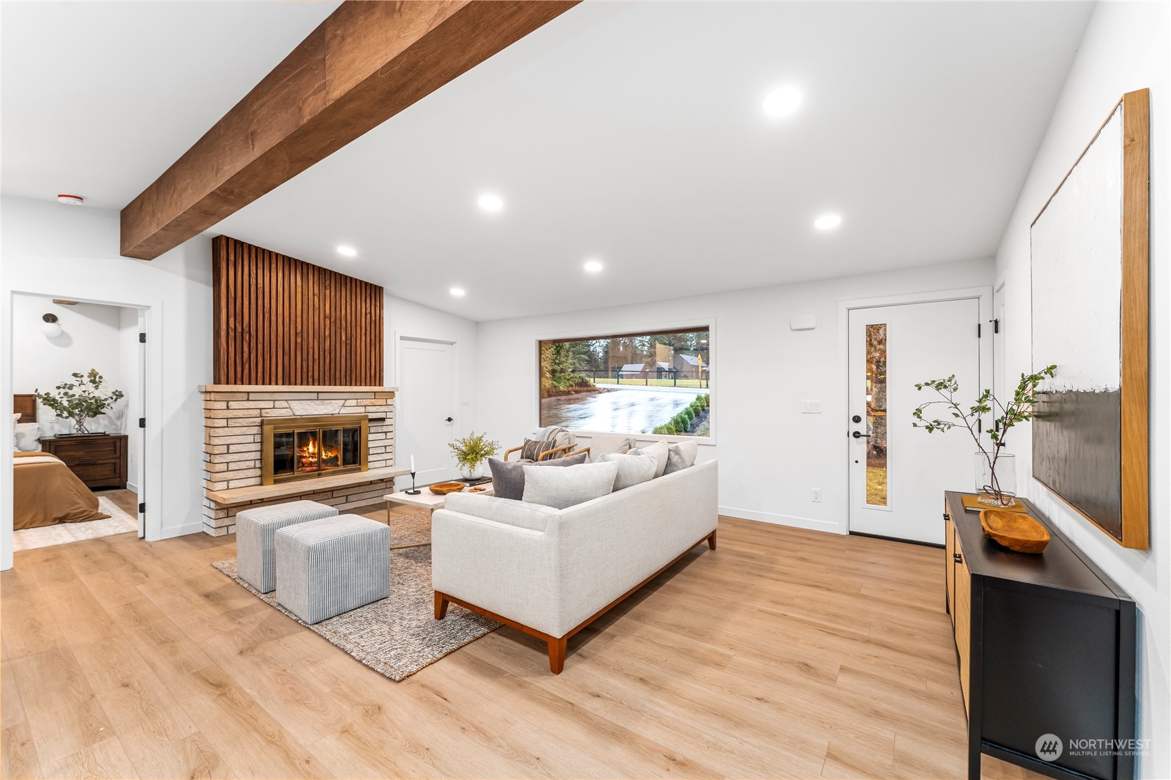 23033 192nd Avenue Southeast Renton, WA 98058 - Photo 5 of 40 a living room with furniture and a fireplace