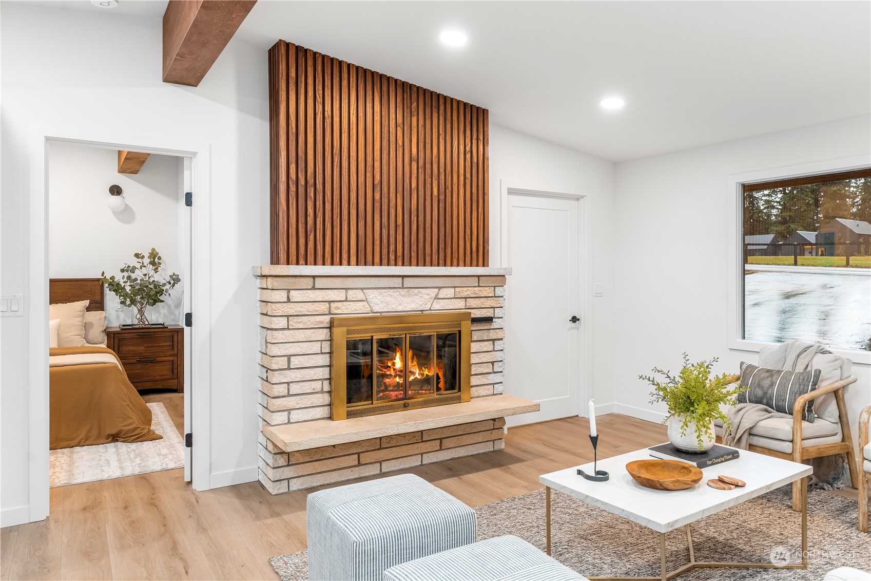 23033 192nd Avenue Southeast Renton, WA 98058 - Photo 6 of 40 a living room with furniture and a fireplace