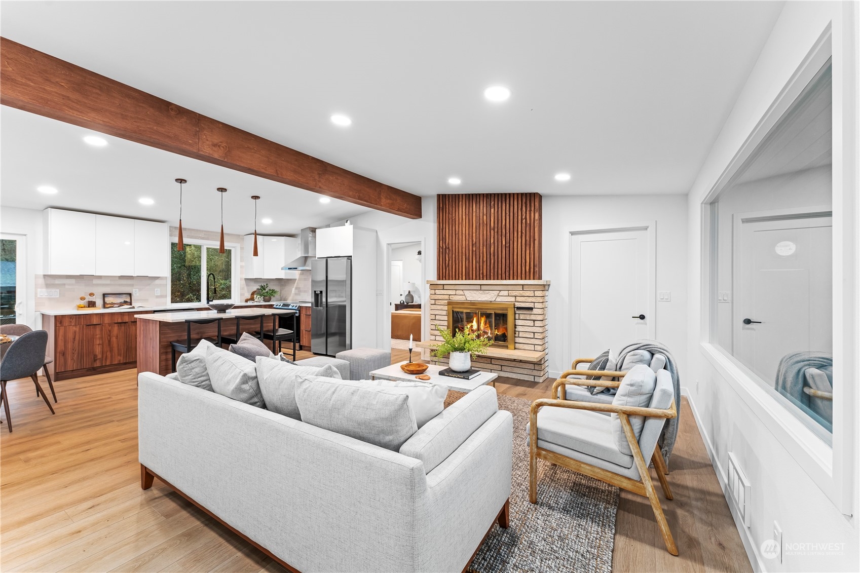 23033 192nd Avenue Southeast Renton, WA 98058 - Photo 7 of 40 a living room with furniture kitchen and a fireplace