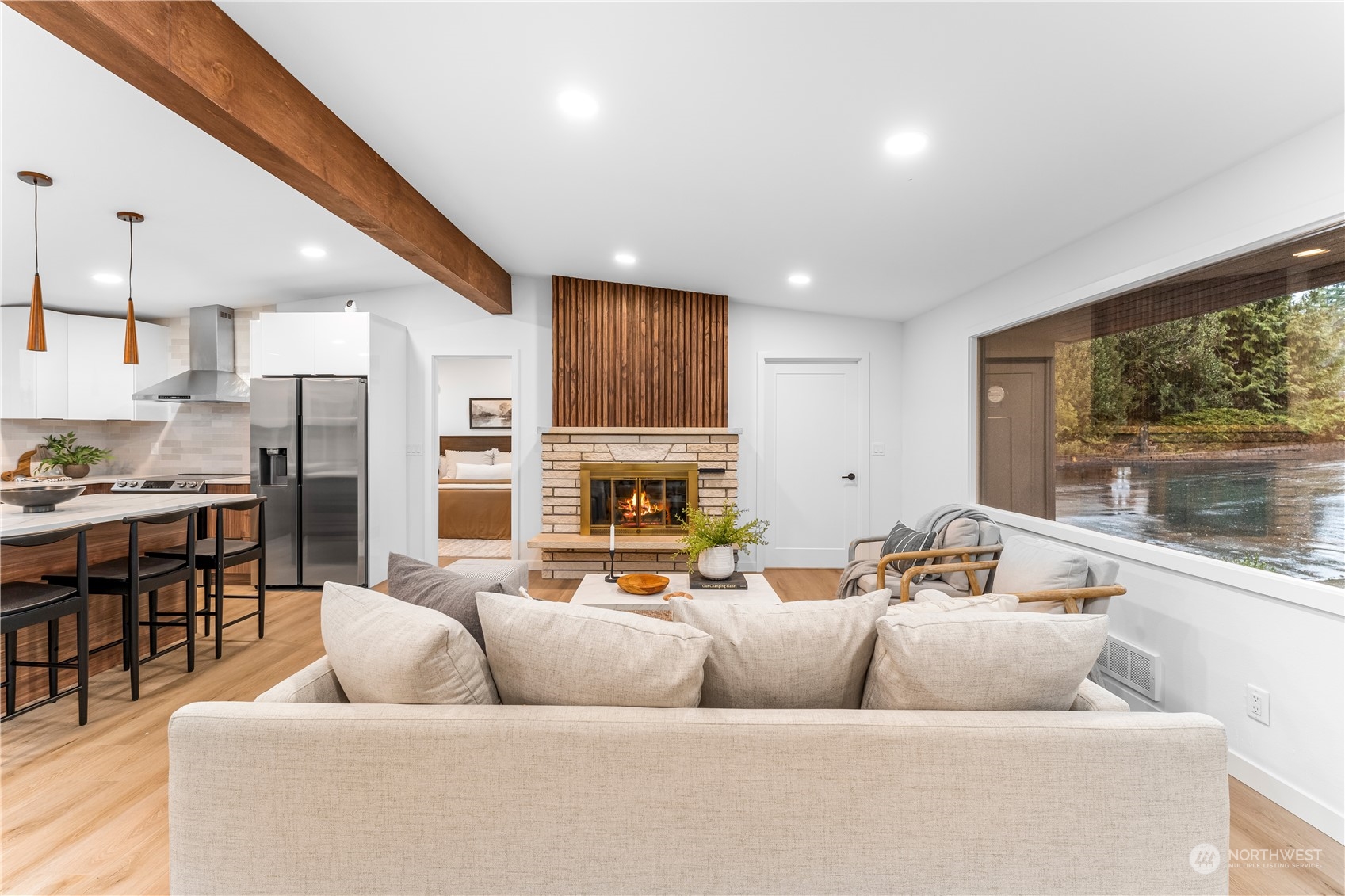 23033 192nd Avenue Southeast Renton, WA 98058 - Photo 8 of 40 a living room with fireplace furniture and a large window