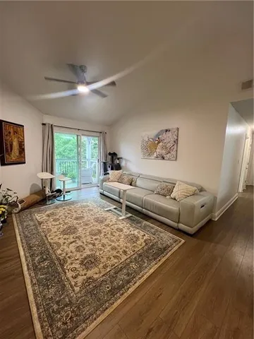 a living room with furniture and a rug