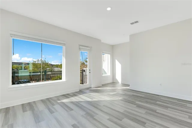 a view of an empty room with a window