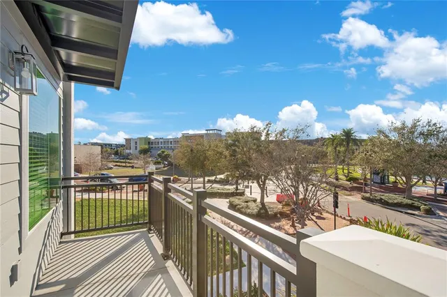 a view of a balcony with chairs