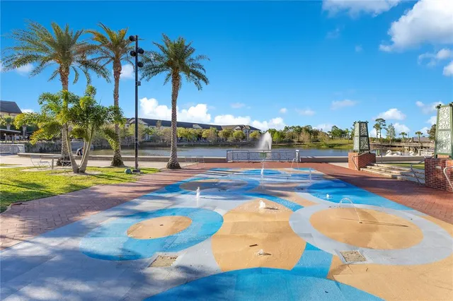 a view of a swimming pool with an outdoor space and seating area