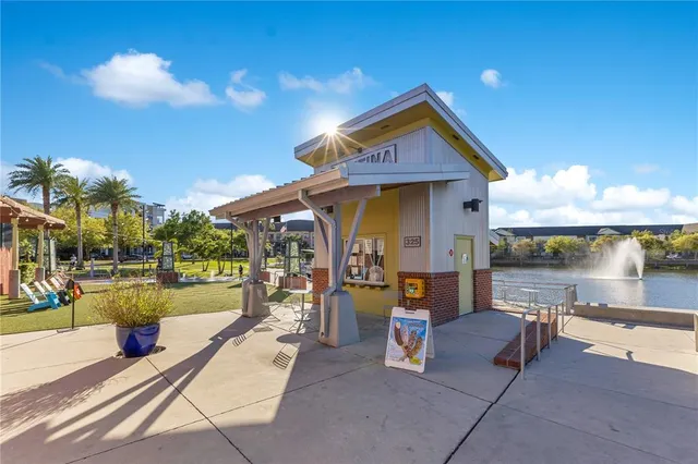 a view of a house with yard and sitting area