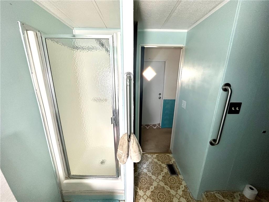 412 Richmond Road Imperial, PA 15126 - Photo 8 of 12 a bathroom with a shower and a mirror